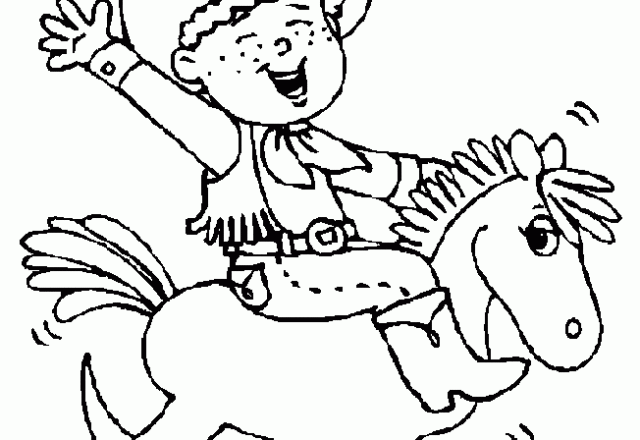 Bambino cowboy sul cavallo di legno